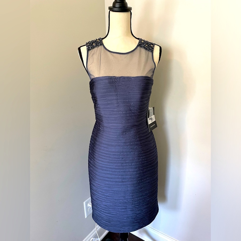 Lovely blue cocktail dress. Sleeveless. Sequin  detail. Never worn. Size 8.